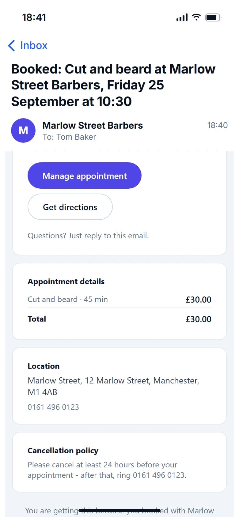 A booking confirmation email from Marlow Street Barbers on a phone, with the appointment details, the shop's address and a Cancellation policy box: please cancel at least 24 hours before your appointment, after that ring 0161 496 0123