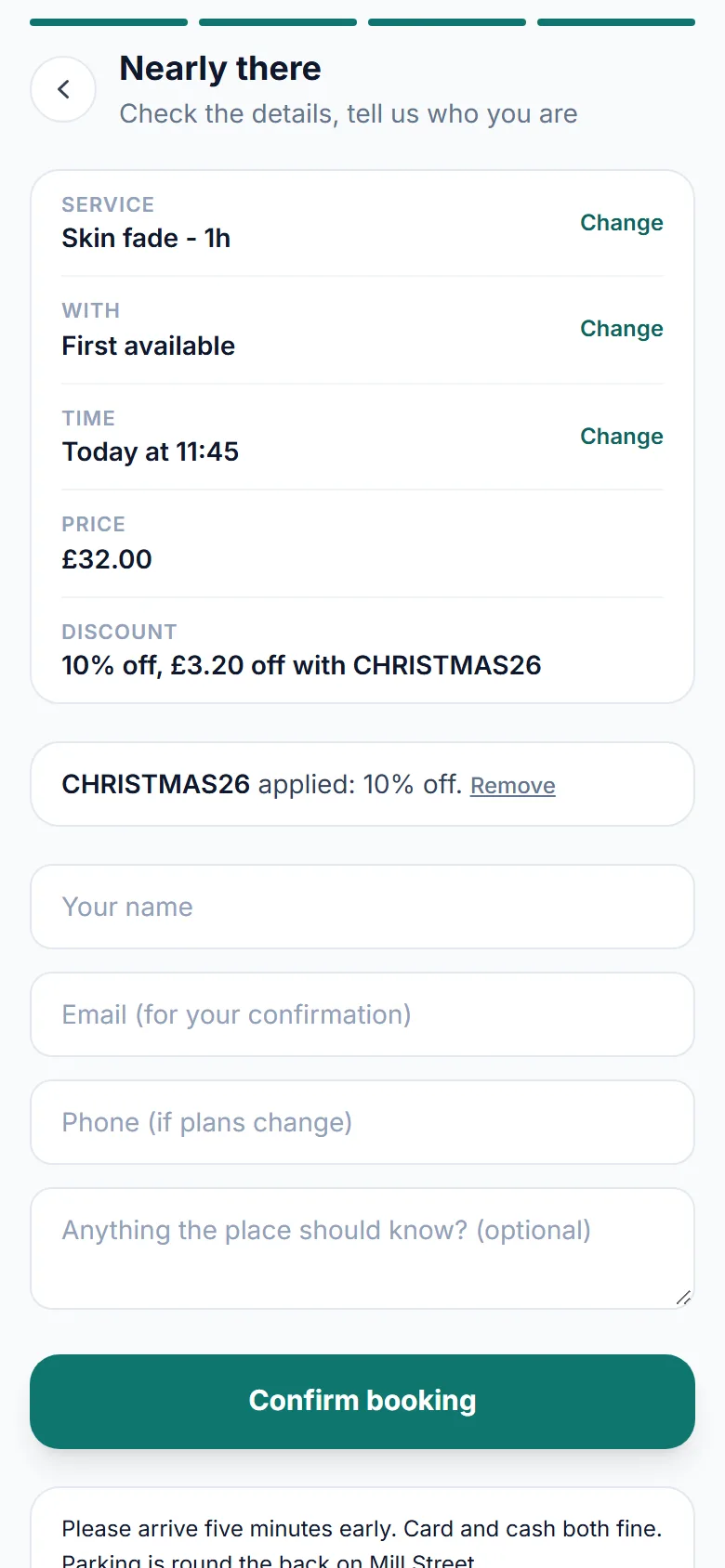 The last step of the booking on a phone: a skin fade at 32 pounds, a discount line reading 10% off, 3.20 pounds off with CHRISTMAS26, and the code box saying CHRISTMAS26 applied